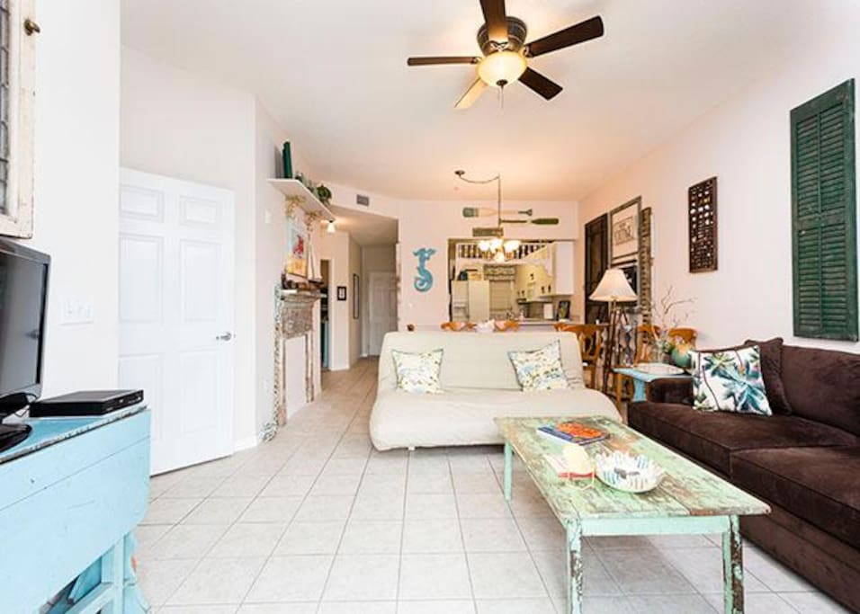 Cool, well furnished, and inviting, our living room awaits! - Stretch out and get comfortable in the airy, well appointed living