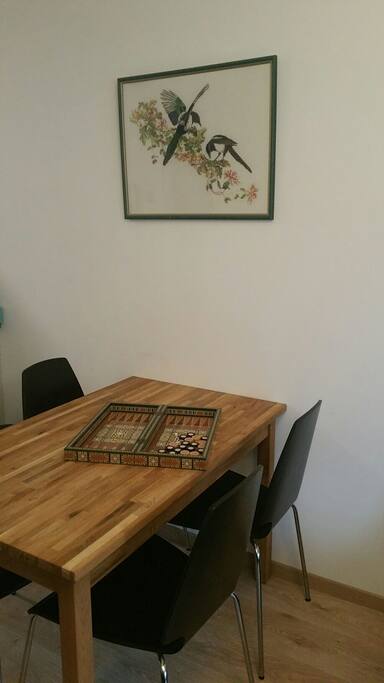 Dining table with a lovely piece of embroidery, homemade by grandma