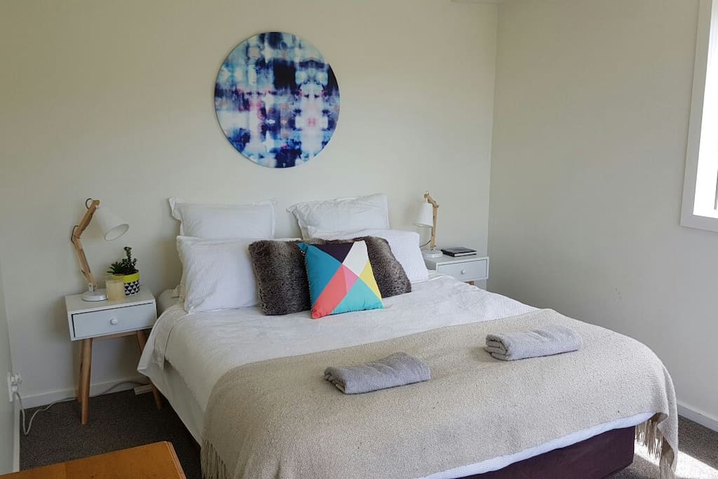 Large sunny room with queen bed