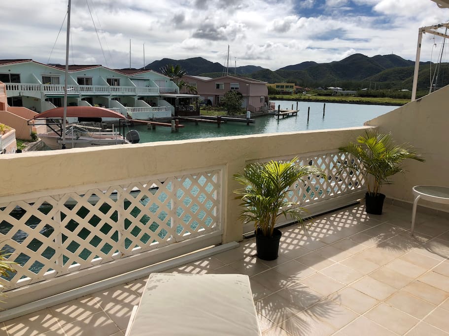 Enjoy waterside views from the patio off the master bedroom