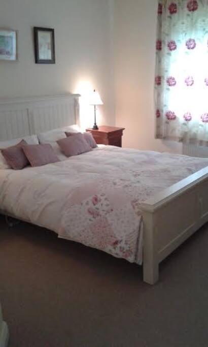 Comfy bed dressed with fresh linen