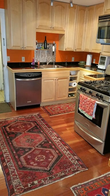 Kitchen with breakfast bar open to the living/dining room