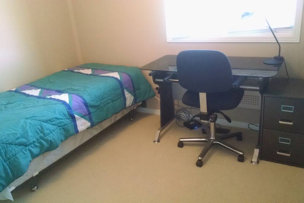 Your room has a single size bed with a desk in a private room.