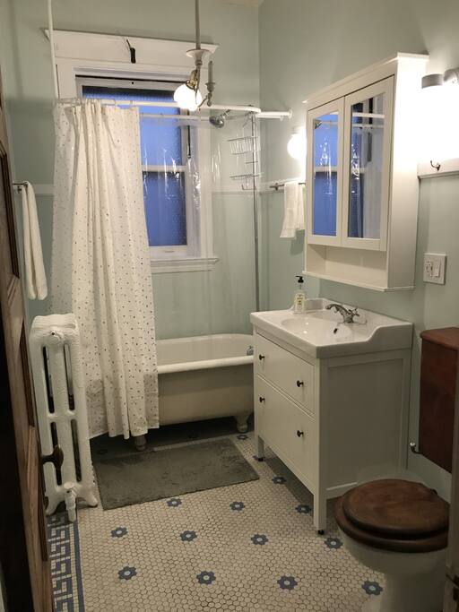 Bathroom with original porcelain tub and toilet