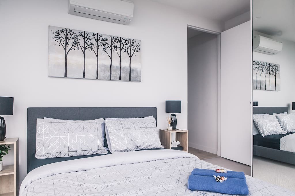 Master bedroom with queen size bed and built in wardrobes