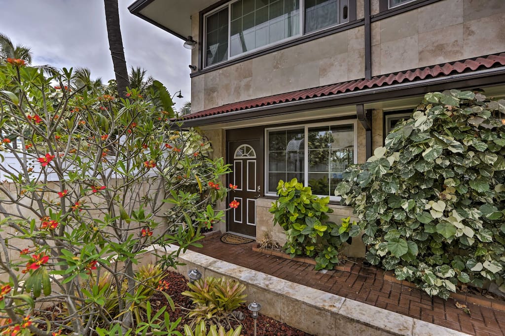 Lush plantings and tropical flora greet you when you arrive at the property.