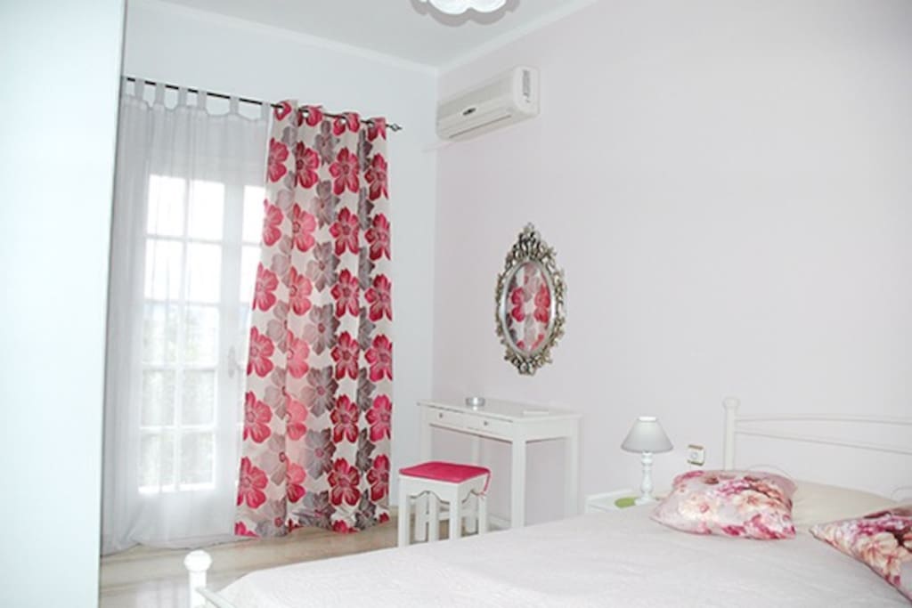 The bedroom with double bed, wardrobe, aircondition.