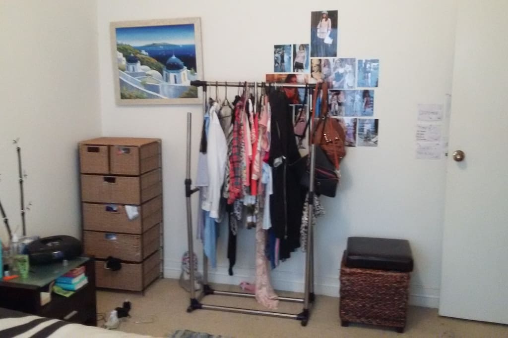 Spacious main bedroom with extra cloting racks