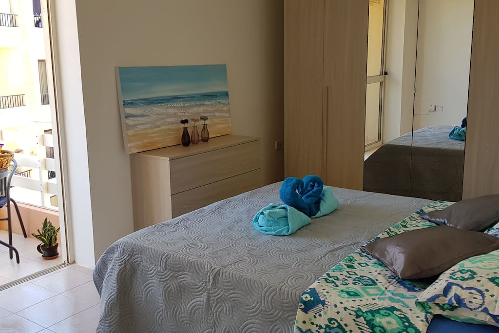 Main bedroom complete with a full 6 unit wardrobe and chest of drawers and a spacious outdoor balcony