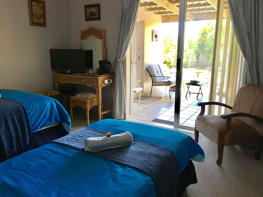 The room has it's own private entrance which also leads out onto the garden and outdoor space.