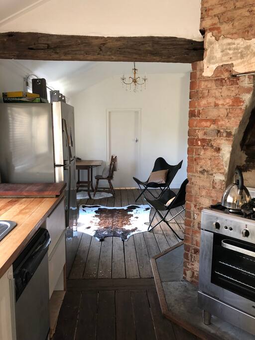 The house is very open, and the fire place is in the middle.