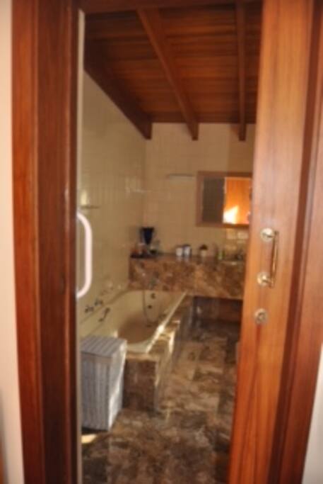 En-suite bathroom with bath and shower.
