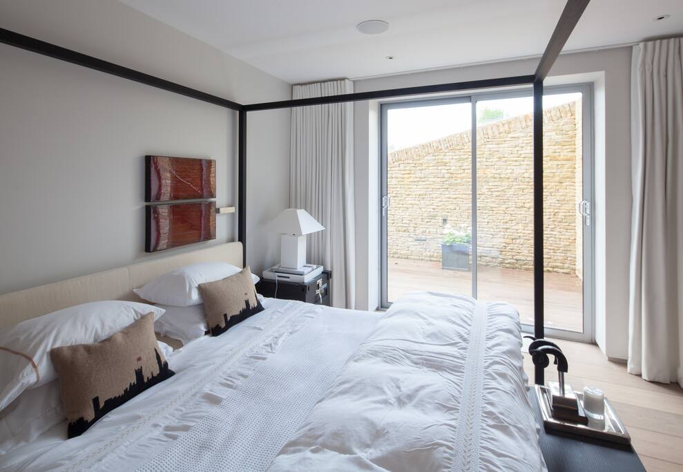 Light filled room with slider to private patio.