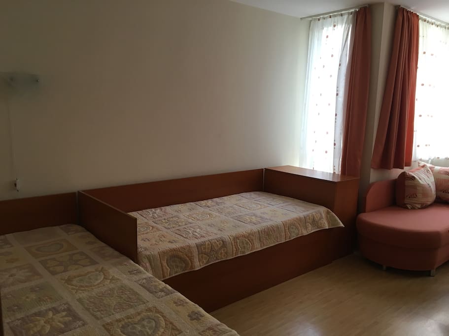 Bedroom with two single beds and one sofa bed.