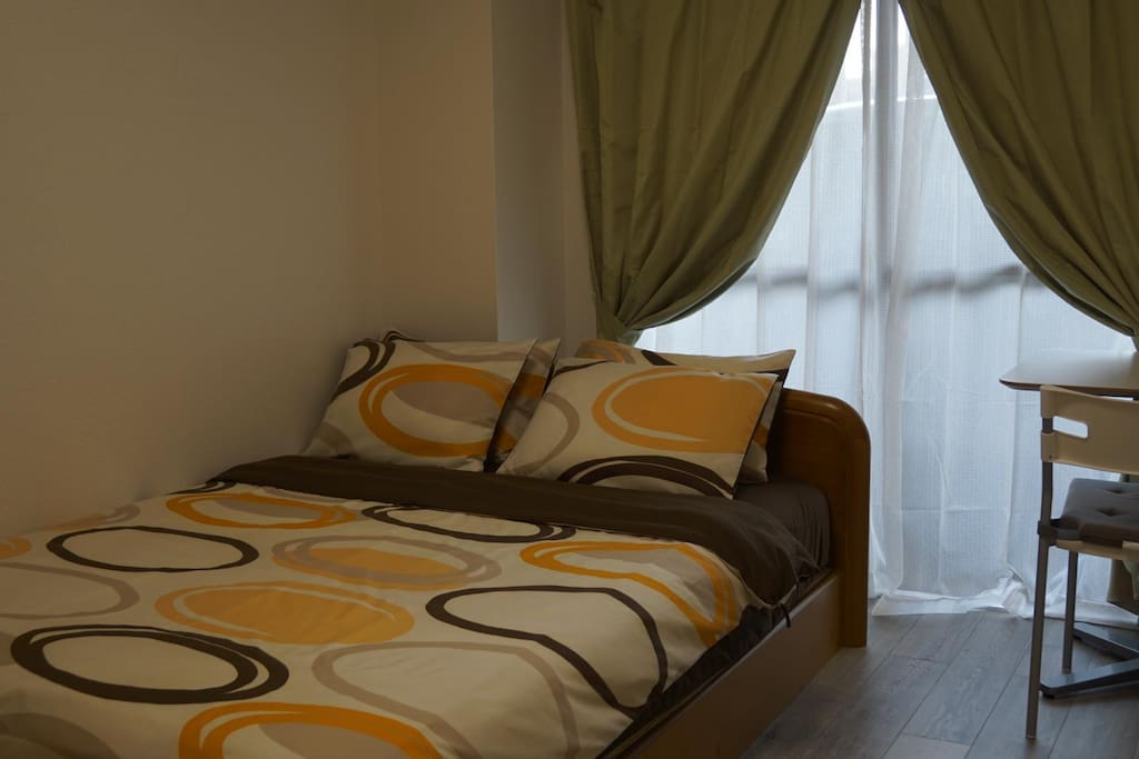 Bedroom at apartment #103 room 1, it has 1 double bed.