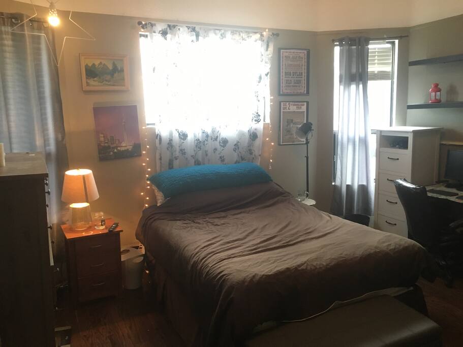 Your room! A Queen-sized bed, desk, fireplace, 2 chairs, closet and shelves. We use one dresser for our own storage, as well as part of the closet. You get the white dresser, shelf space, and closet space.