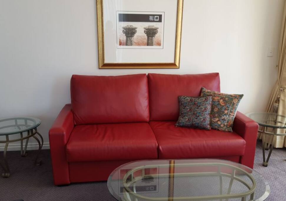 Open plan living area with large smart TV which is connected to the sky feed including movies and sport at no extra charge.