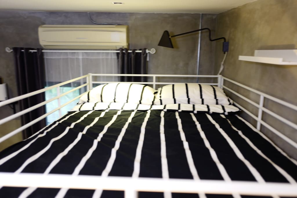 Spacious top bunk comfortably accommodating up to 2 guests.