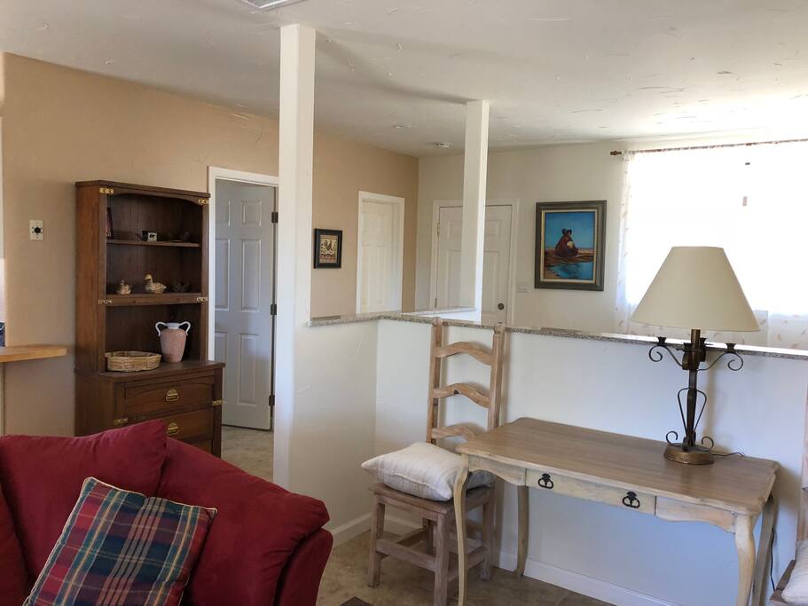 half partition separating queen bed from den