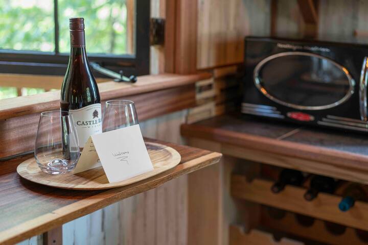 A complimentary bottle of wine awaits — along with fresh flowers, original, stunning art, hand-crafted surroundings, and every single amenity you expect and deserve, right inside the treehouse.
Credit: Dickerson arts.com