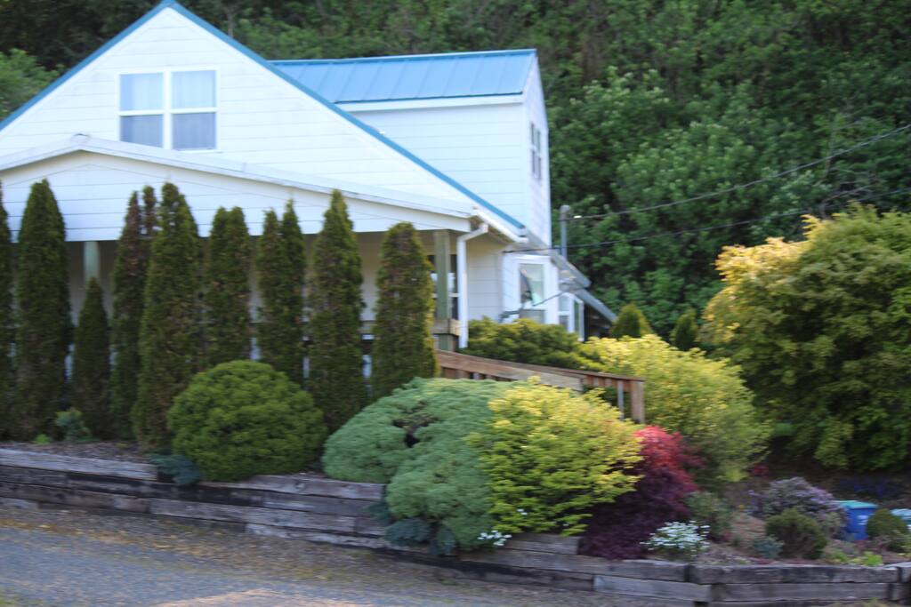 Covered Front porch overlooking the road and the estuary