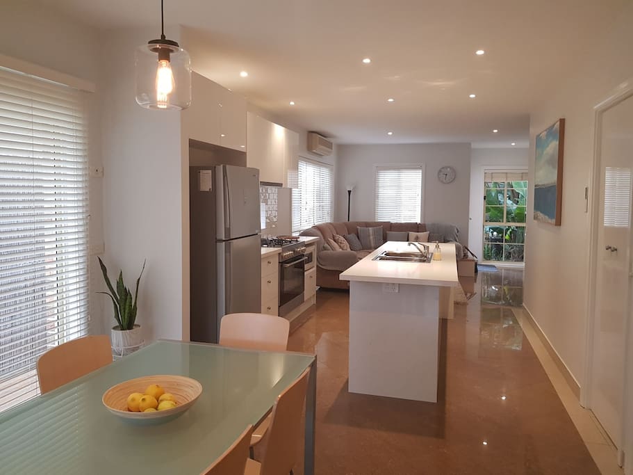 Open plan design with euro laundry (washer, dryer, iron and ironing board)