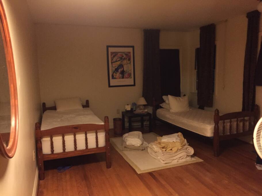 Twin beds in room 1, fresh sheets and a blanket are provided
