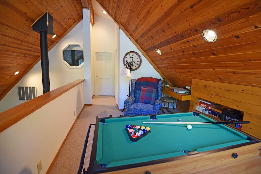 Upstairs pool table for guests to enjoy on nights at the home