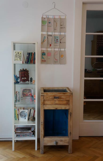 Guest bedroom. Books and old fridge transformed in a closet.