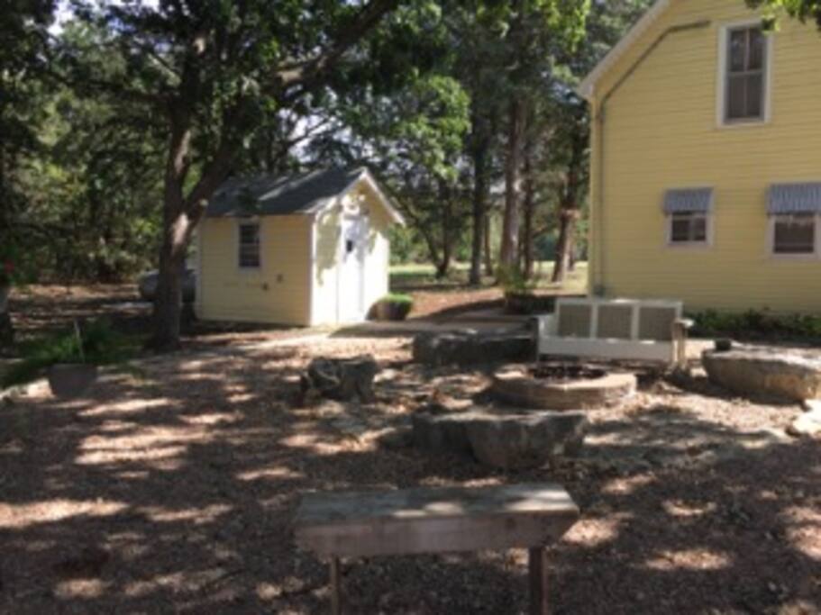 Wash House outside of Guest House. Fire pit area. We also have a charcoal grill for your use with charcoal and lighter fluid supplied.