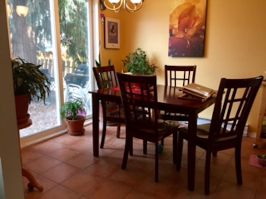 Dining room with sliding door to yard, with more seating and bbq area.