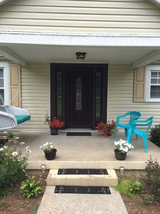 Front door with nice porch area for sitting outside.