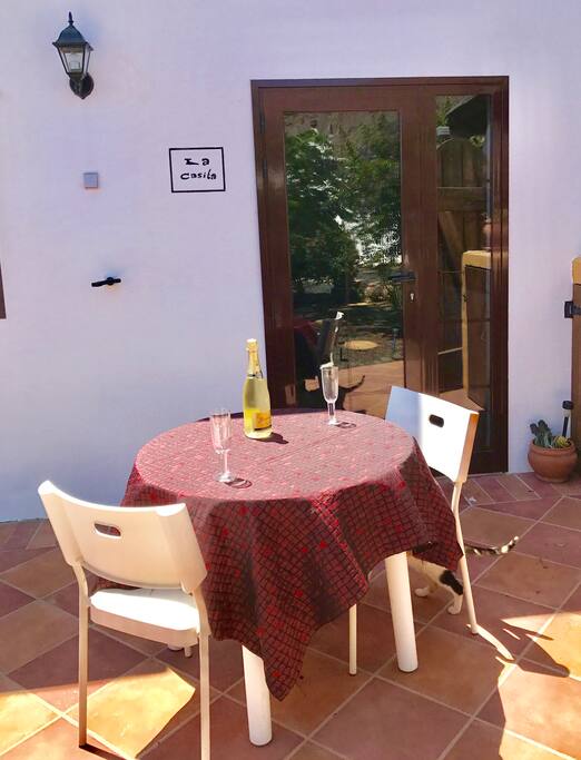 Entrance to apartment and outside dining.
