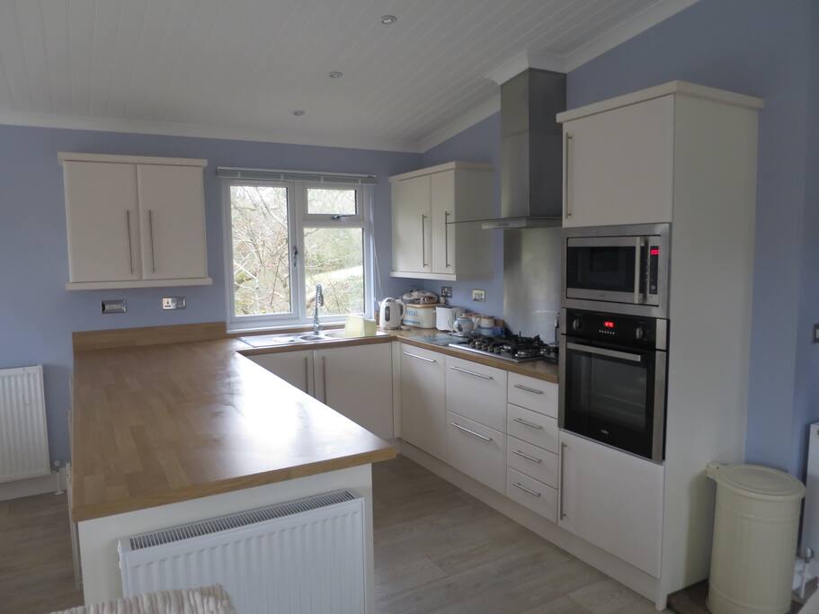 Fully equipped kitchen with dish washer, washing machine, Nespresso coffee machine and Nutribullet smoothie maker for your use.