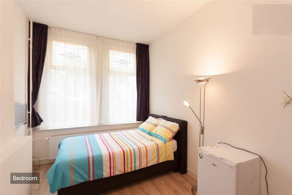 Bedroom with Fridge