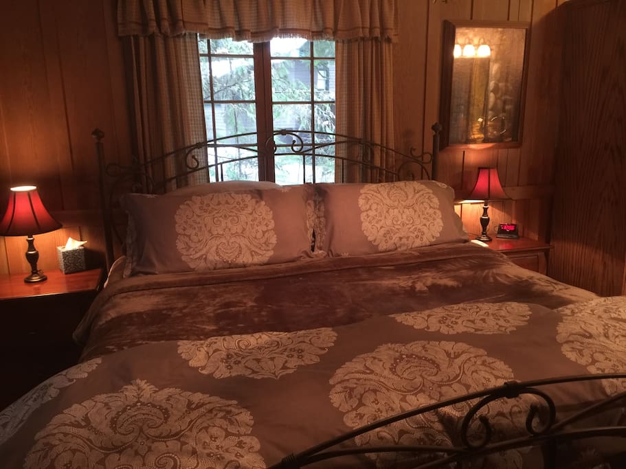 Master Bedroom with a Massive, Very Comfortable King Bed, ceiling fan, private bath and TV