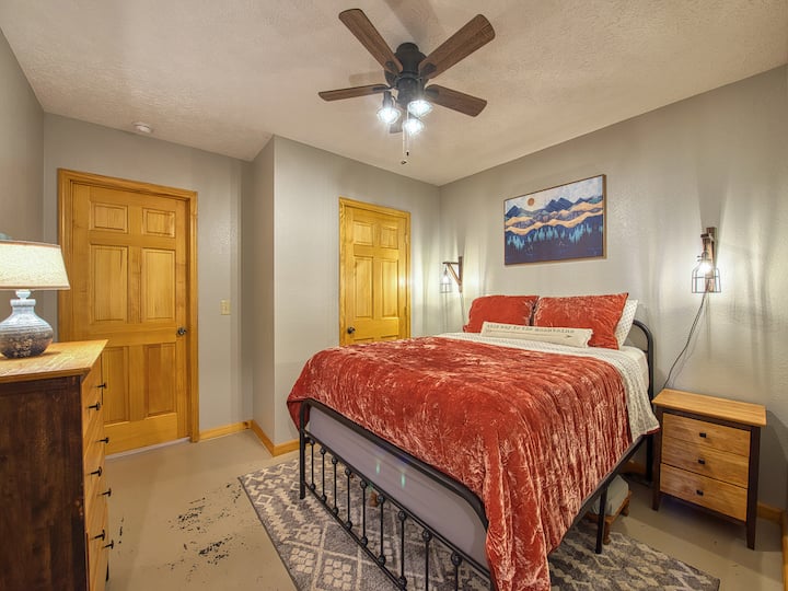 Downstairs bedroom with queen bed