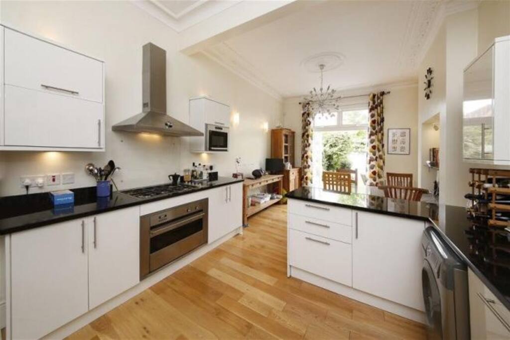 Well set up kitchen opening into the garden