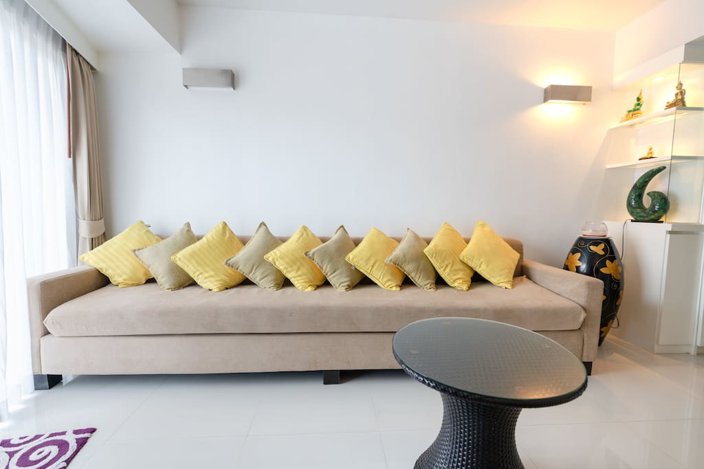 Plenty of cushions on the custom made settee. It's so long - 3metres- even the tallest guests can unwind