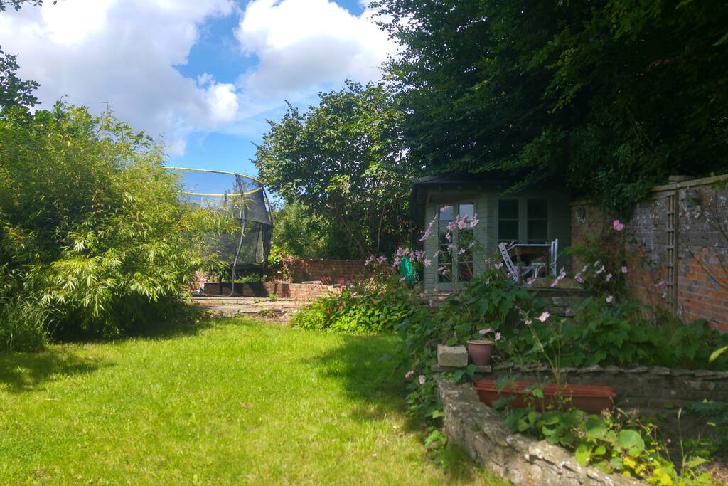 View from studio with garden trampolene and summer house