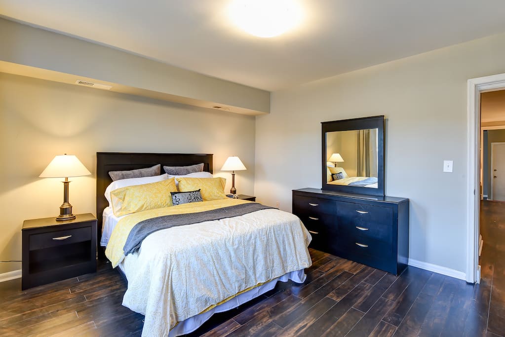 Night stands, a dresser, and a closet provide ample storage space.