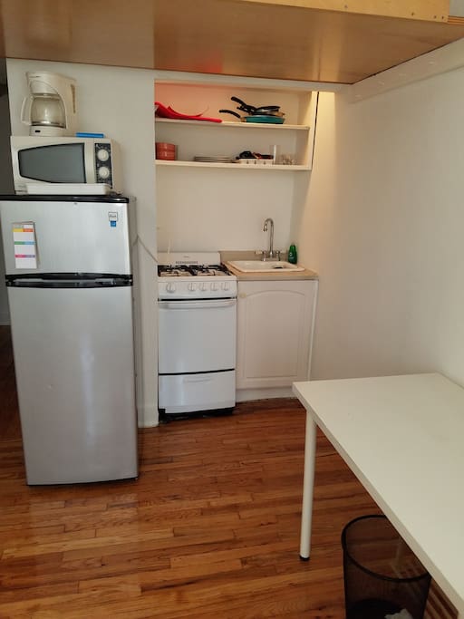 Kitchenette has gas stove, full refrigerator, microwave, table, dishes, coffee maker, etc.