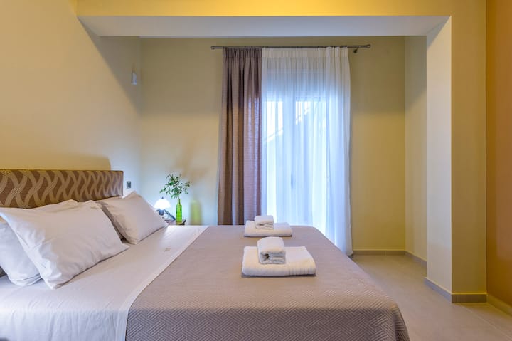 - A double bedroom with a wardrobe, overlooking the southern part of the estate and the surrounding mountains.  