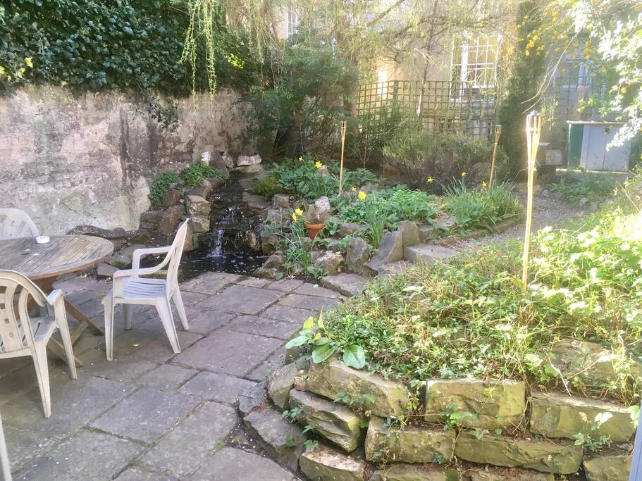 Private hidden garden with pond & waterfall.