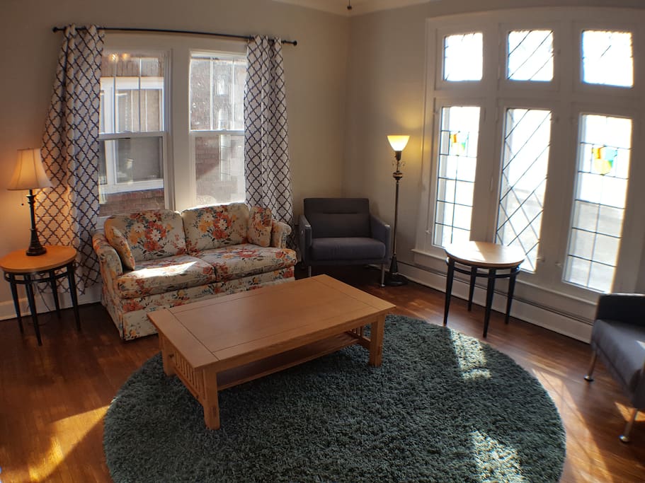 Living Room with stained glass windows facing the park