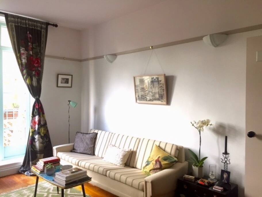 One side of the main room - with long sofa and coffee table.