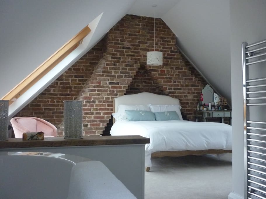 Attic master bedroom with free standing bath.