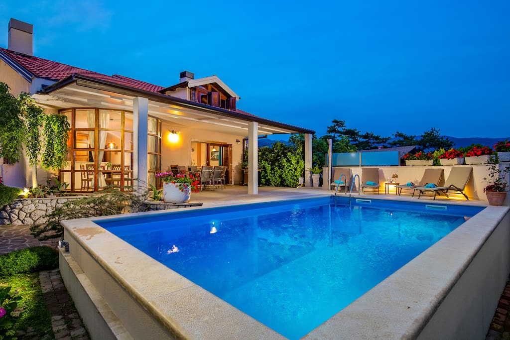 House and swimming pool at night