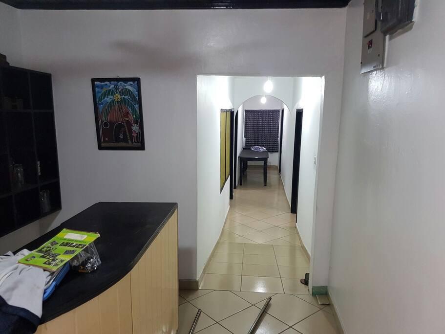 Corridoor showing entrance to 4 bed rooms with multiple beds. Also connects to two separate toilets and two major bathrooms. Wifi easily accessible around bar area.