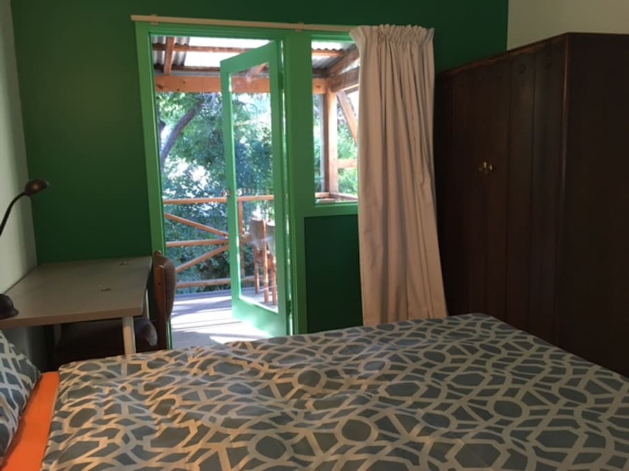 Your bedroom is a quiet and light room with a balcony overlooking the green back garden.
